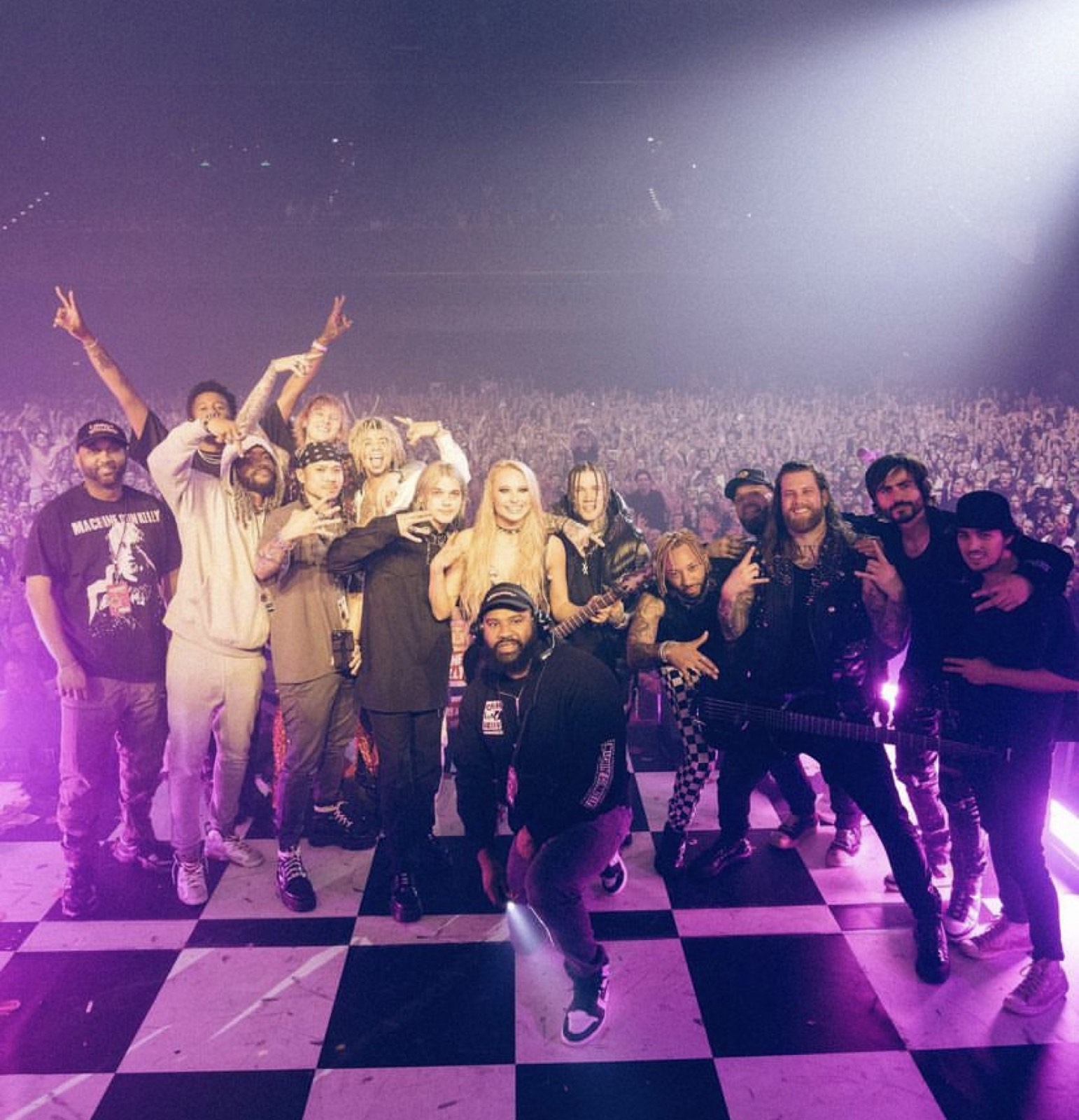 Band and crew on stage after a show